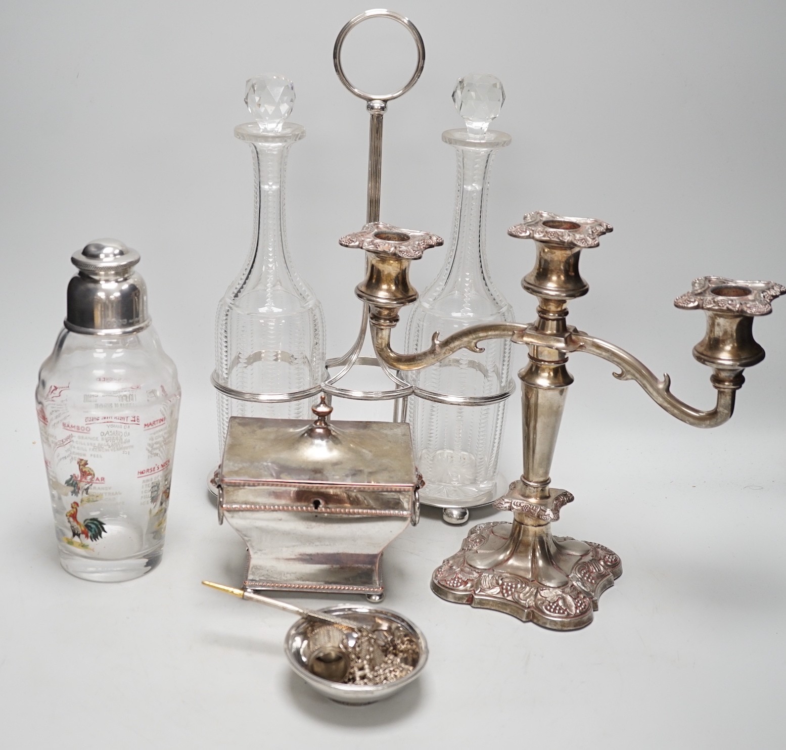 Assorted plated items including a decanter stand with two bottles, by Hukin & Heath and a tea caddy etc.